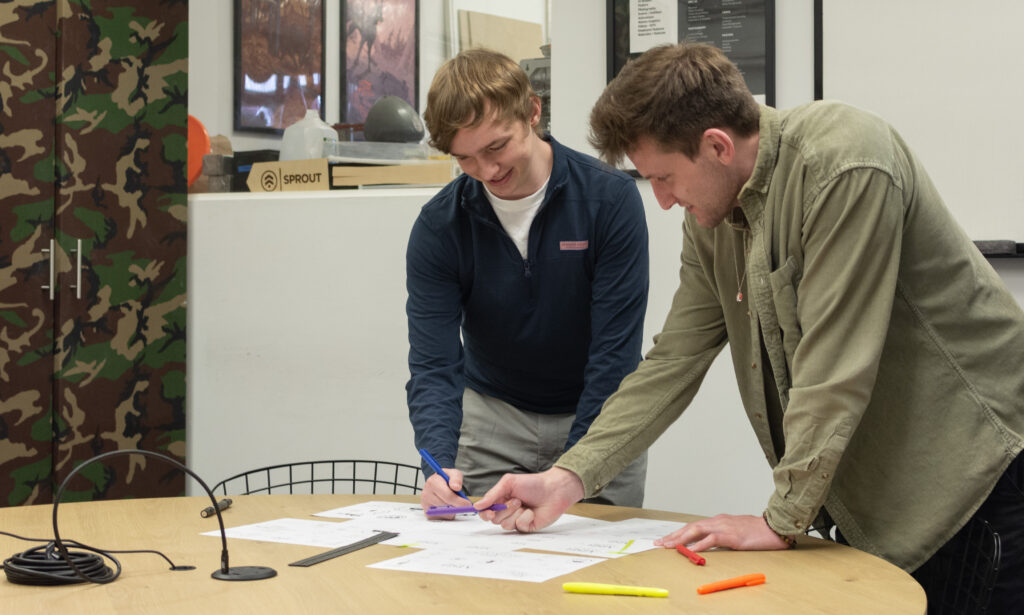Sprout Studios designer pictured with sketches during the product development process