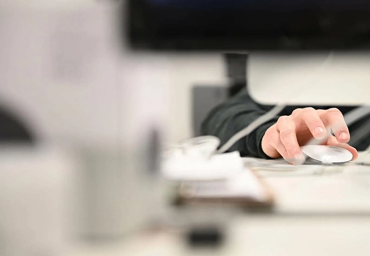 Designer using a computer mouse